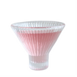 Clear glass vase with pink ribbed design on a white background