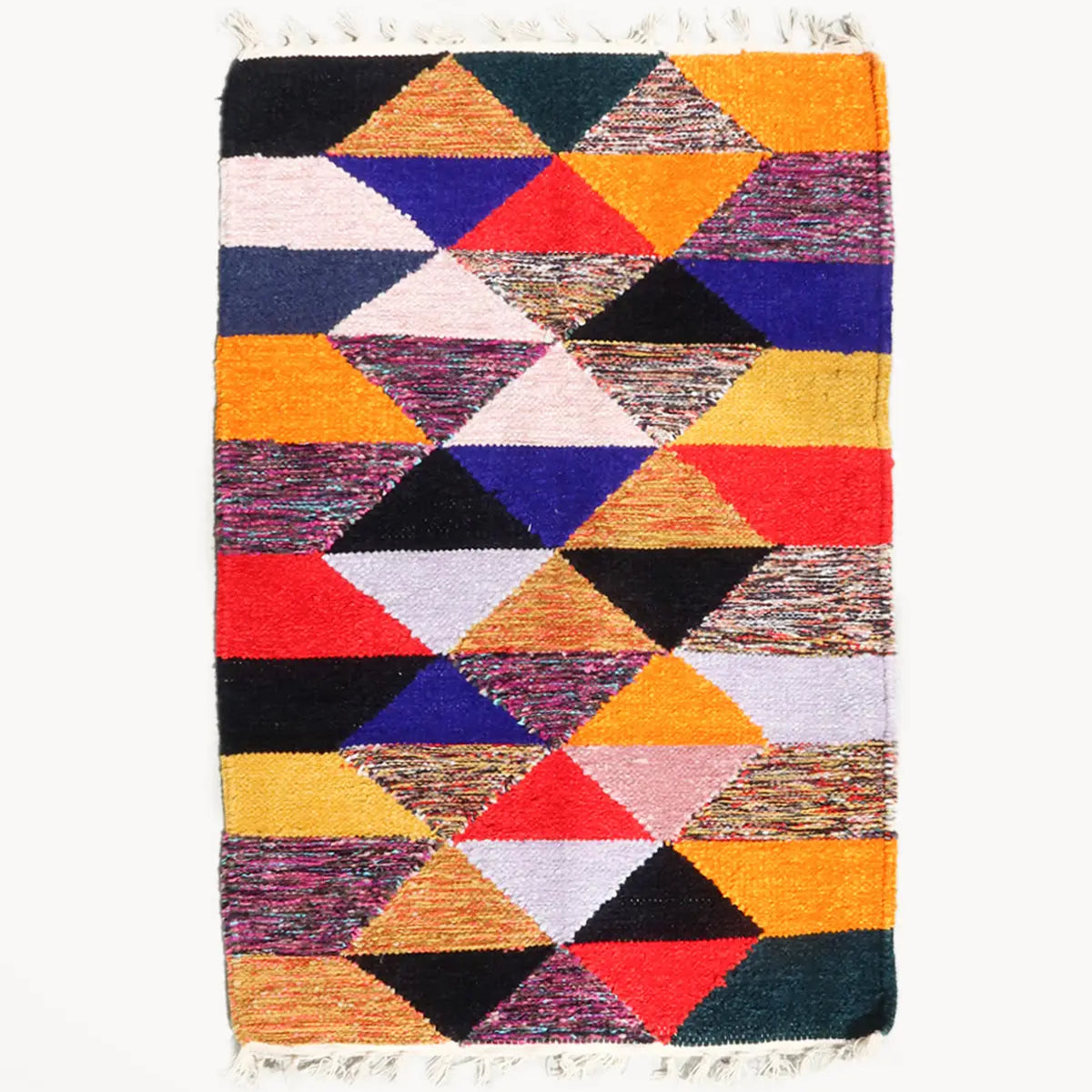 Multicolored geometric patterned rug on a white background