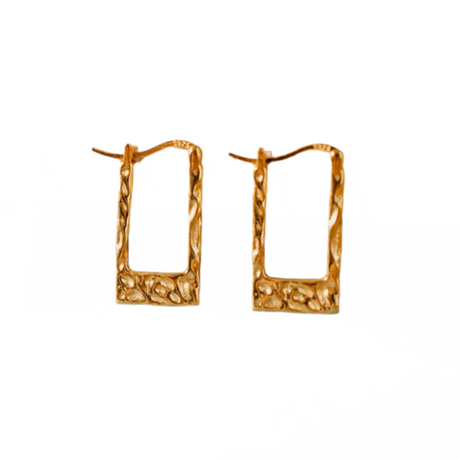 Gold hoop earrings on a white background