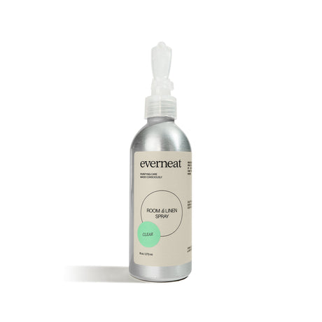 Silver spray bottle labeled 'everneat' on a white background