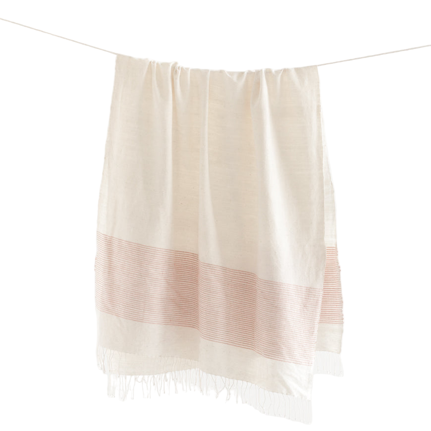 White towel with a pink stripe hanging on a white background