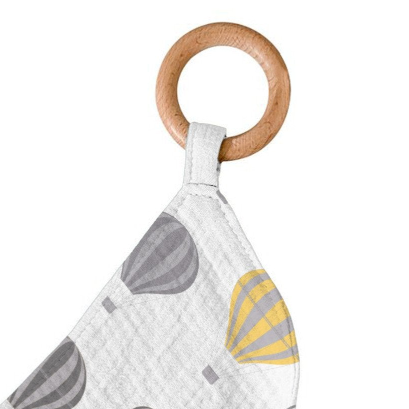 Baby teething ring with wooden ring and fabric strap featuring hot air balloon design on a white background