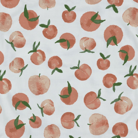 Patterned fabric with peach design on a white background