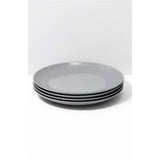 Set of four gray plates stacked on a white background