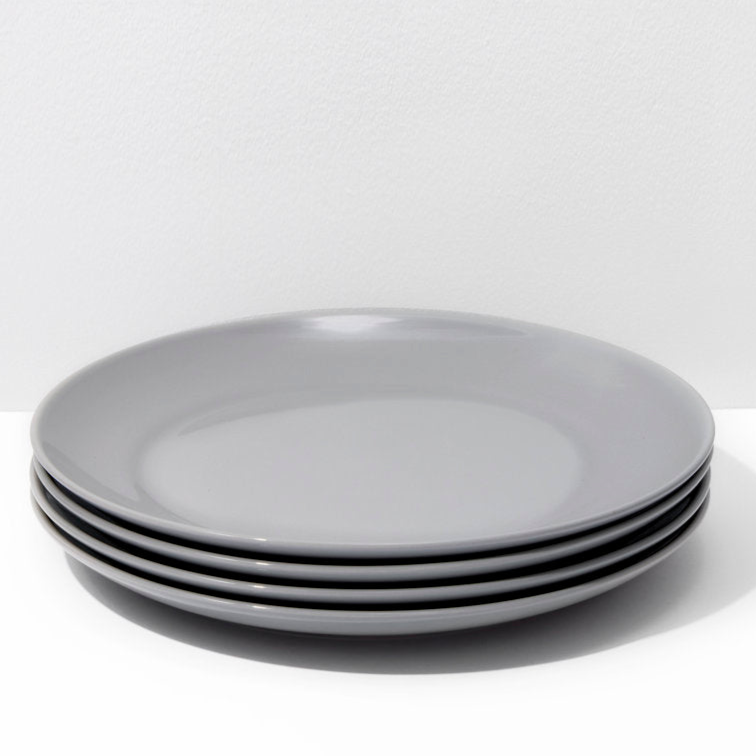 Stack of gray plates on a white background