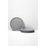 Set of gray ceramic plates on a white background