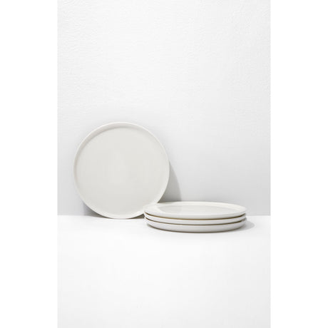 Set of white ceramic plates on a white background