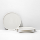 Set of white ceramic plates on a white background