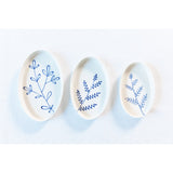 Three ceramic plates with blue floral patterns on a white background. Süheyla Nesting Plates
