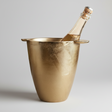 Gold champagne bucket with a bottle of champagne on a white background