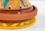 Tagine featuring decorative patterns on a white background
