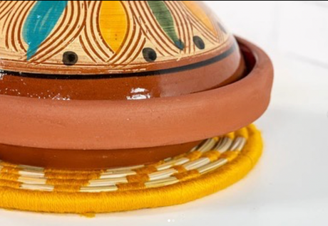 Tagine featuring decorative patterns on a white background