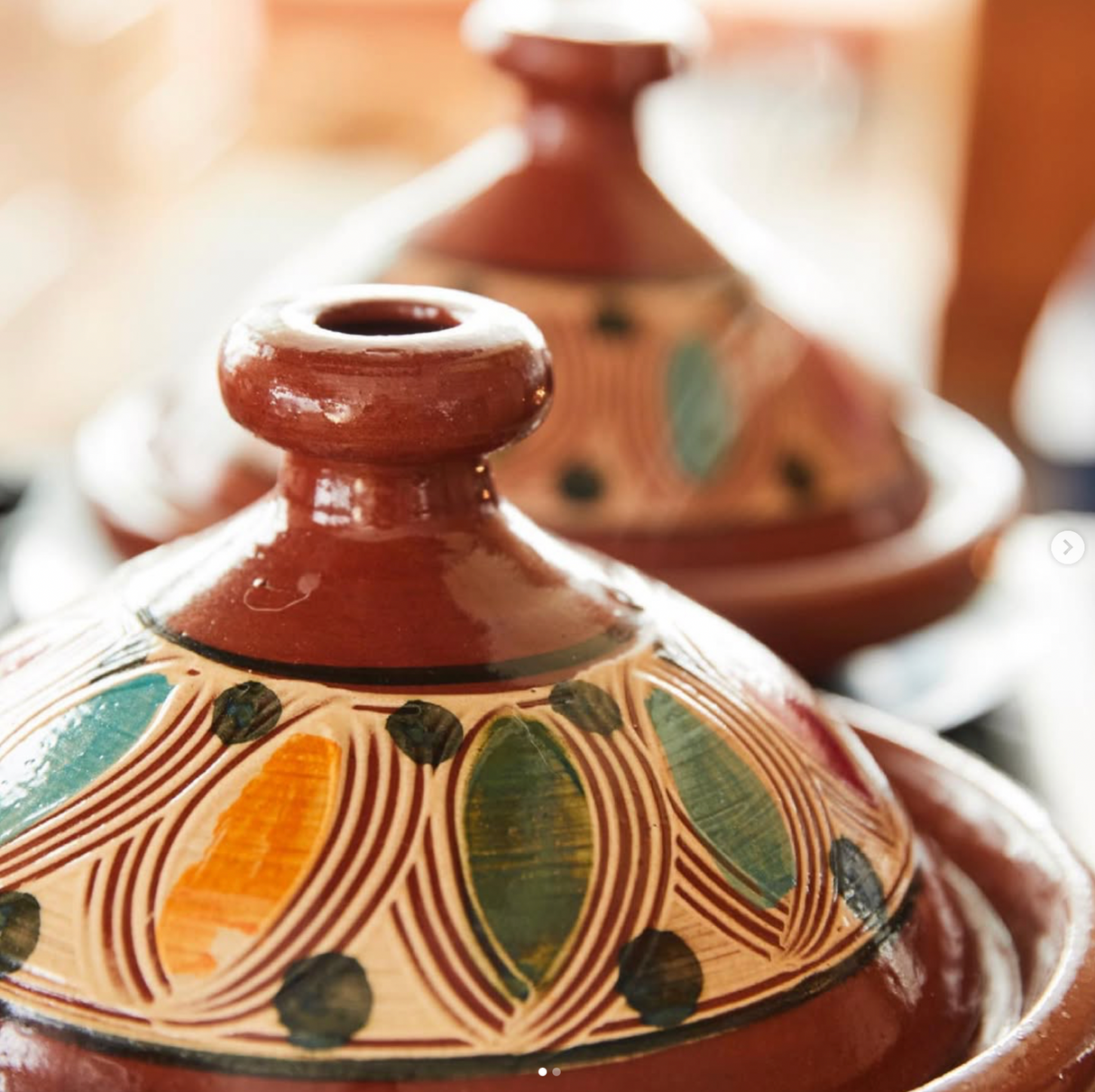 Tagine with decorative patterns on a blurred background