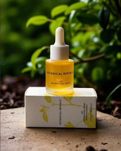 Botanical Republic skincare serum bottle with dropper on a white box against a natural background