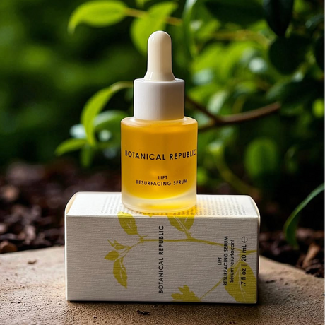 Botanical Republic Lift Resurfacing Serum bottle with dropper on a white box against a natural background