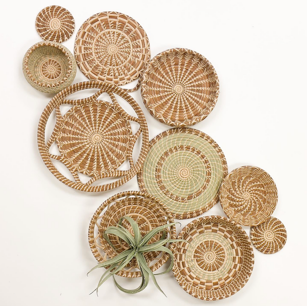 Collection of woven baskets in various sizes on a white background