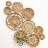 Collection of woven baskets in various sizes on a white background