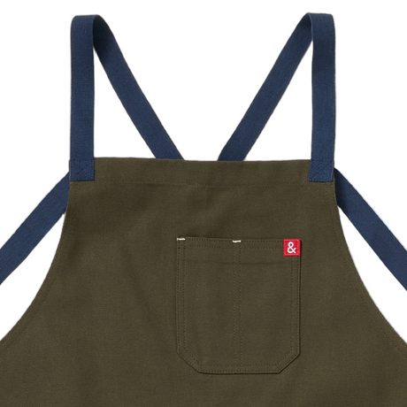 Brown apron with blue straps on a white background
