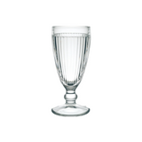 A La Rochere Antillaise Ice Cream Cup filled with water stands elegantly on a plain white background, its clear ribbed glass showcasing a classic design.