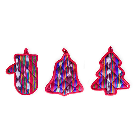 Set of three colorful quilted hot pads shaped like a mitten, bell, and tree on a white background.