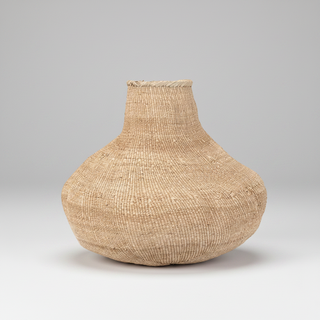 Woven basket on a gray background