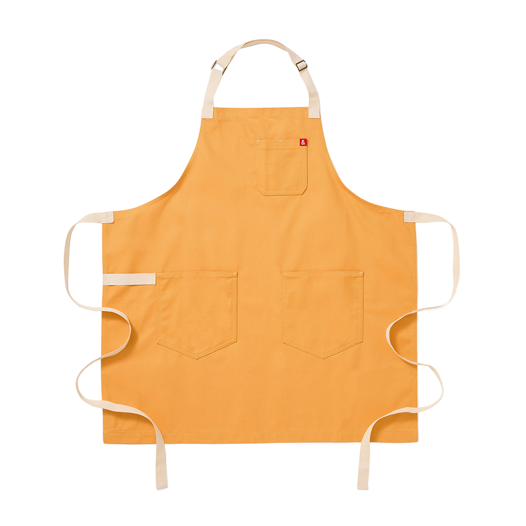 Yellow apron with white straps on a white background