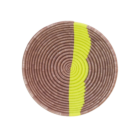 Round woven basket with brown and yellow pattern on a white background