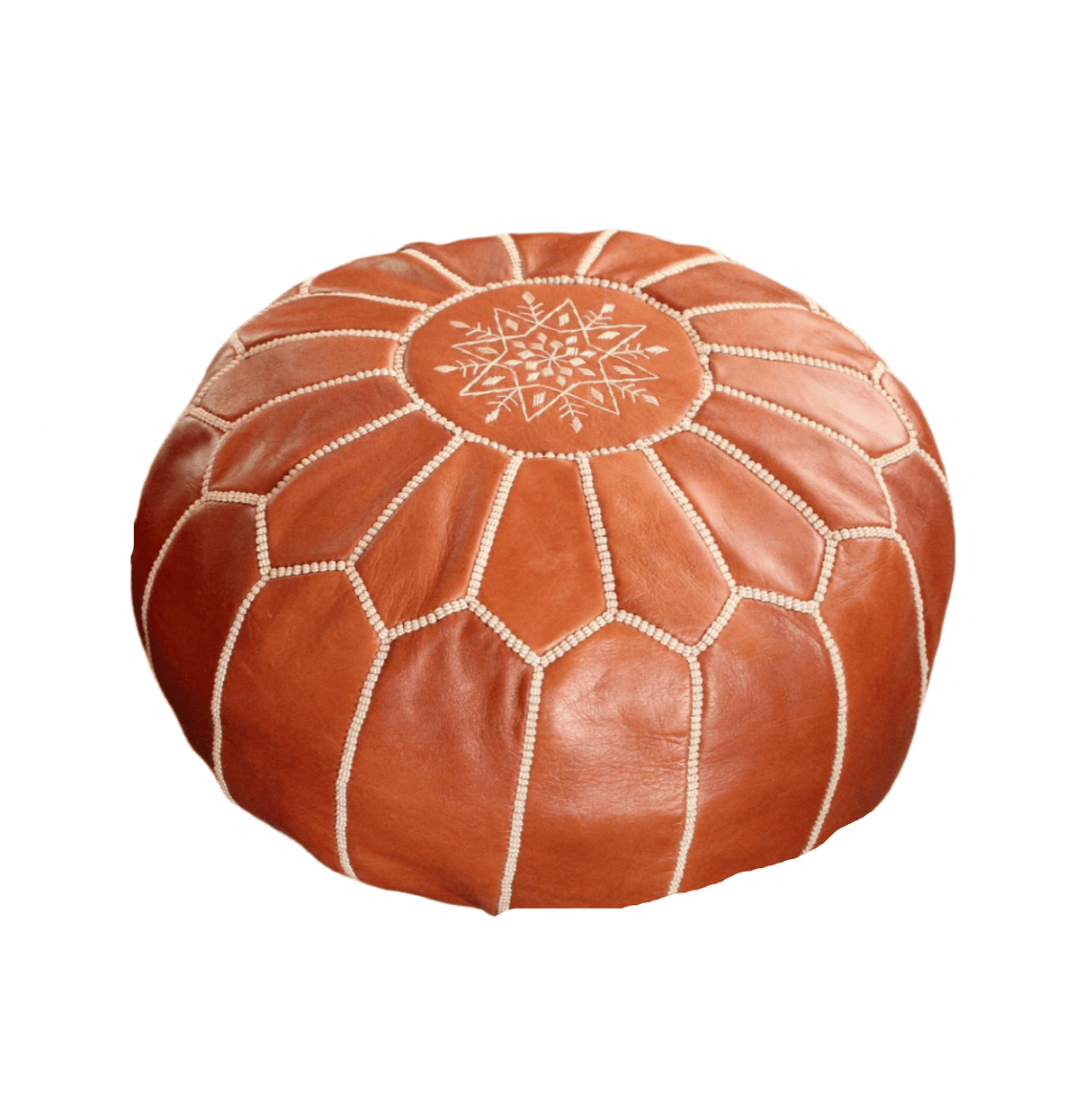 Brown leather pouf with geometric pattern on a textured surface