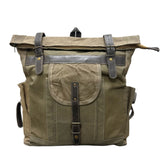 Green backpack with leather straps on a white background