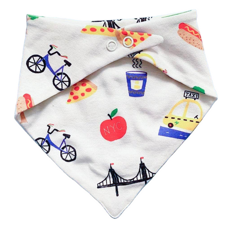 Baby bib with colorful illustrations of bicycles, pizza slices, an apple, a taxi, and a bridge on a white background.