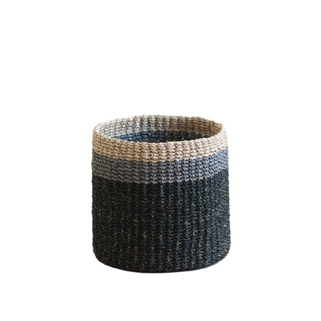 Woven basket with two-tone design on a white background