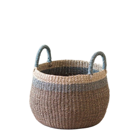 Woven basket with handles on a white background