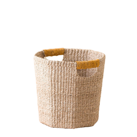 Woven basket with a yellow handle on a white background