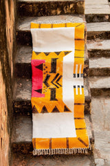 Colorful patterned rug on a set of stone steps