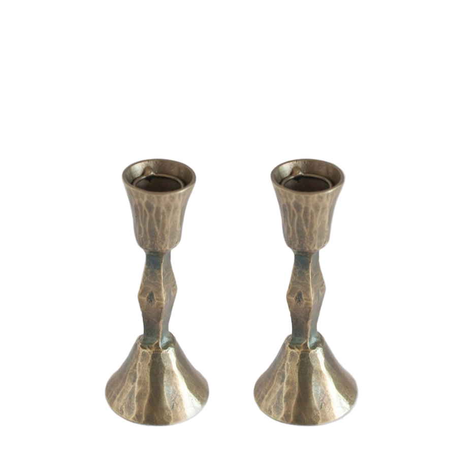 Two metallic candle holders on a white background