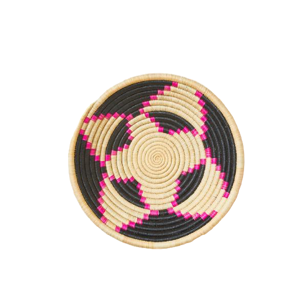 Round woven basket with black and pink pattern on a white background