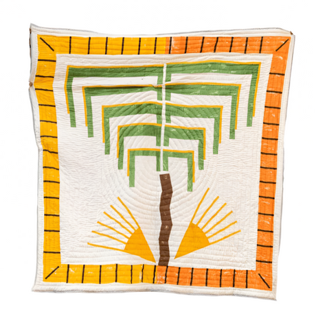 Quilt with geometric pattern on a white background