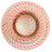 Coral-colored ceramic plates and bowls on a light surface with a spoon and napkin.