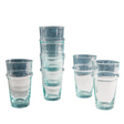 Set of clear glass tumblers with blue rim on a white background