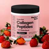 Perfect Keto collagen peptides container with strawberries on a pink background