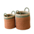 Two woven baskets with green handles on a white background