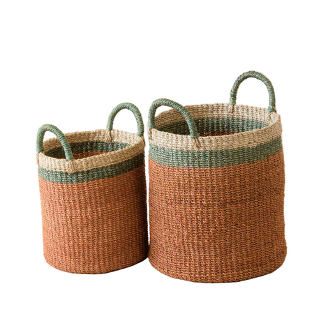 Two woven baskets with green handles on a white background