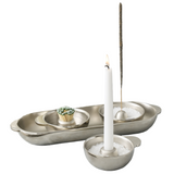 Candle holder with candles, incense sticks on a white background