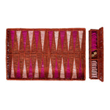 Backgammon set with pink and brown pieces on a white background