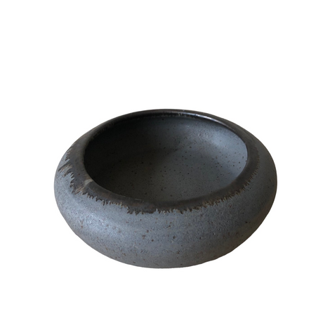 Black ceramic bowl on a white background