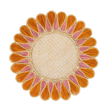 Decorative round placemat with orange and pink petal-like patterns on a white background