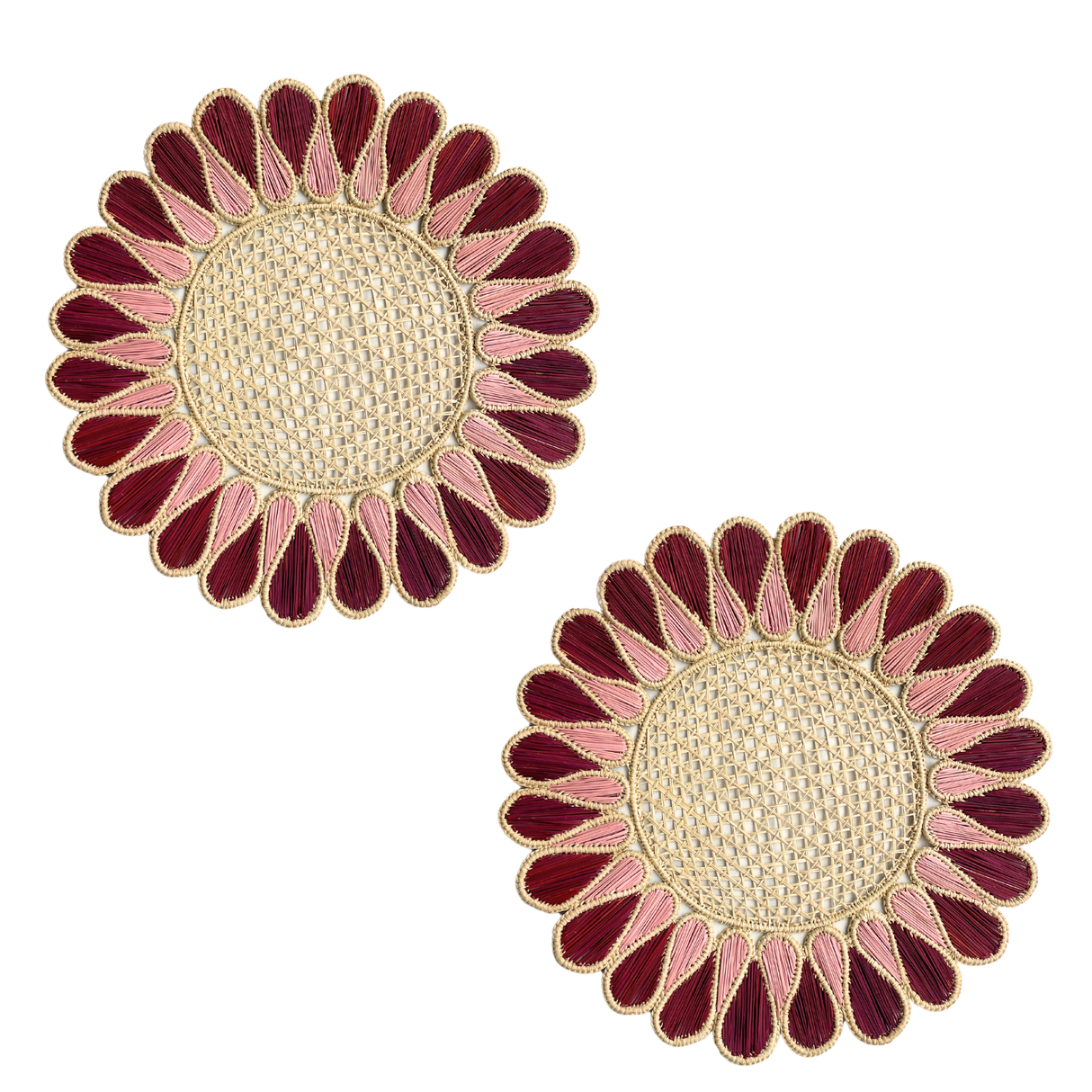 Pair of sunflower-shaped placemats with red and pink petals on a white background