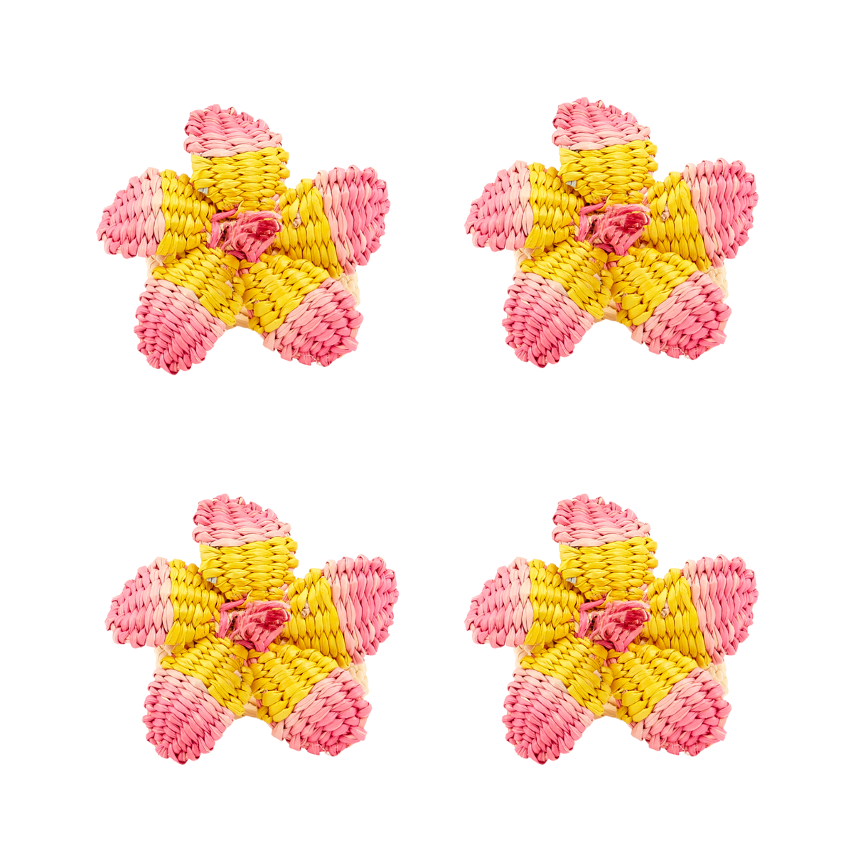 Four pink and yellow hibiscus napkin rings on a white background