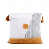 Decorative pillow with geometric design on a neutral background