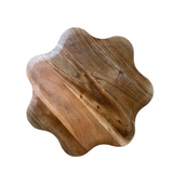 Wooden cutting board with a unique shape on a white background